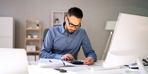 CFO crunching numbers on a calculator 