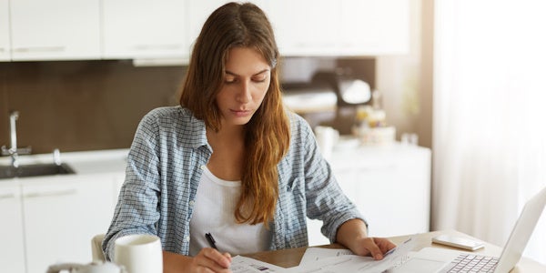 Small business owner reviewing documents